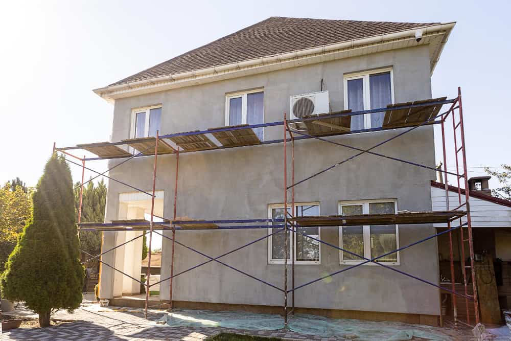 reconstruction-house-insulation-house-with-polystyrene-foam-plastering-applying-plaste-1